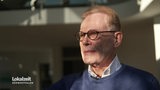 Ein Mann mit Brille