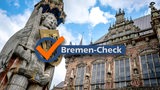 "Bremen-Check"-Logo vor dem Bremer Roland und Bremer Rathaus